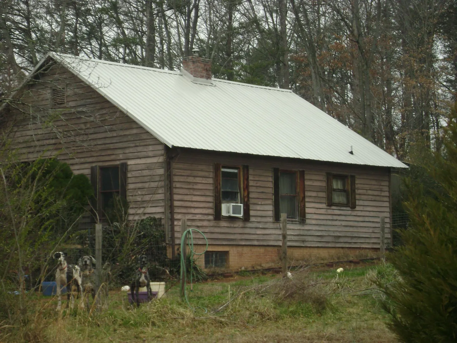 White metal roof on an old wood sided farmhouse, from a Asphalt Shingle Roof Repair job in Union